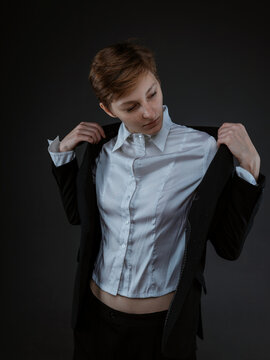 Women straightens her jacket