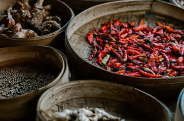 Coffee plantation in Bali, Indonesia. Plants, coffee leaves and seeds in woven baskets. 