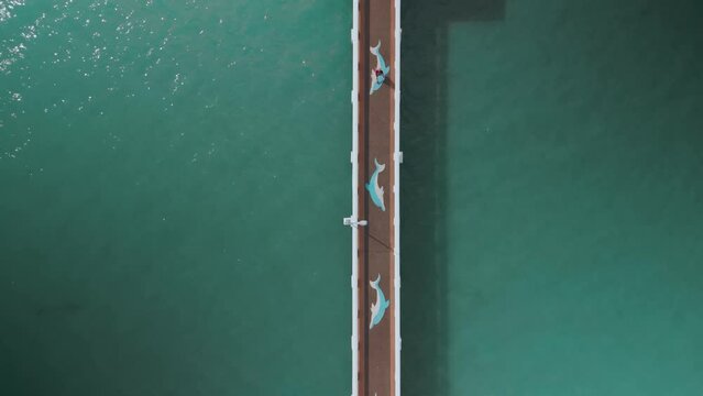 aerial view of pier,top view,people walking along pier