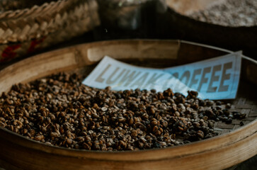 Coffee plantation in Bali, Indonesia. Plants, coffee leaves and seeds in woven baskets. 