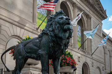 Detail of a metal sculpture of a lion in the streets of Chicago