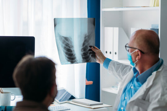 Doctor Analyzing X -Ray Image