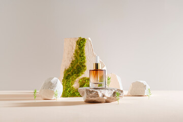 Serum and oil cosmetic bottle on a concrete stone with moss podium