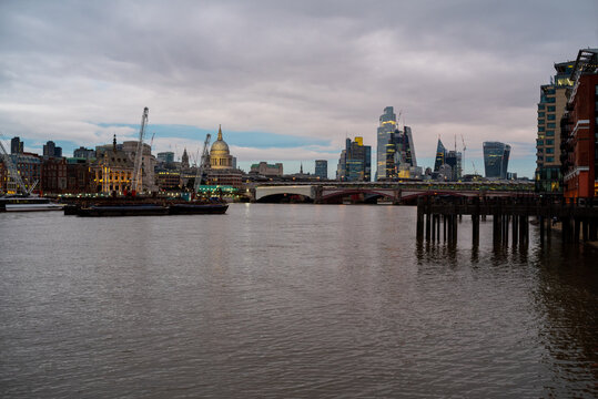 London cityscape at dusk from river thames