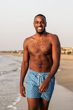 Smiling black man on the beach