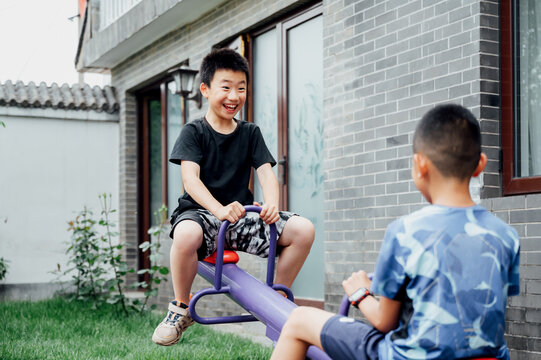 Kids riding on a seesaw