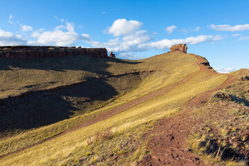 View on Chest butte or Onlo Mountain. Sunny landscape of mountain range Sunduki in Khakassia, Russia. First Sunduk under blue sky. Traveling in Russia concept.