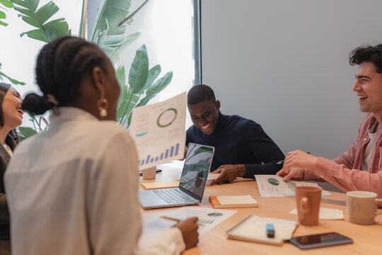 Business team laughing during meeting
