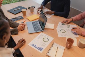 Diverse managers analyzing reports together