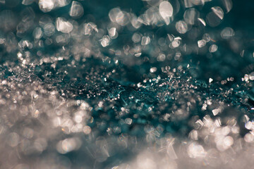 Jewel-like turquoise wet light bokeh texture 