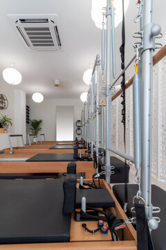 Pilates reformers in light studio