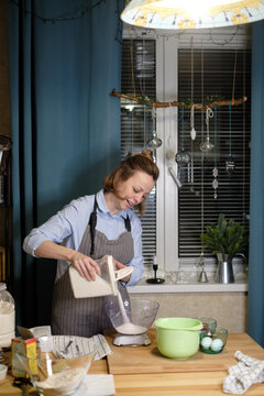 Woman baking Christmas cookies at home