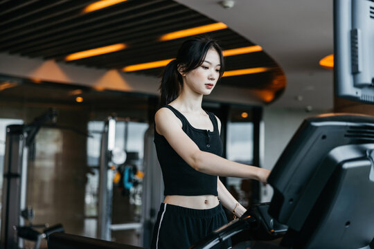 Woman using the treadmill.