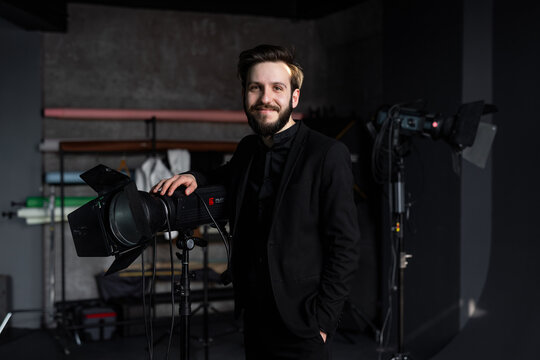 Professional photographer smile in studio