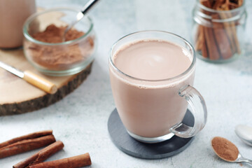 A glass mug with hot chocolate