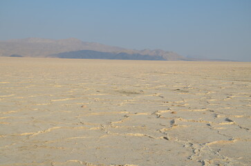 flat white surface of pink lake near Shiraz, Iran