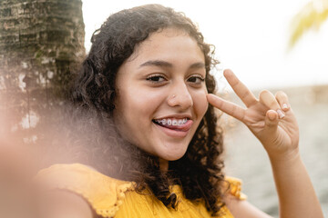 teenage woman taking a selfie