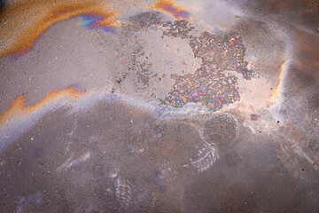 Beautiful abstract colorful background, engine oil stains on asphalt