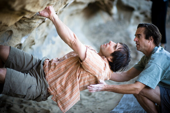 Two climbers bouldering at Lizard's Mouth in Santa Barbara.