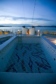 Empty swimming pool onboard a cruise ship on the ocean in the north Pacific.