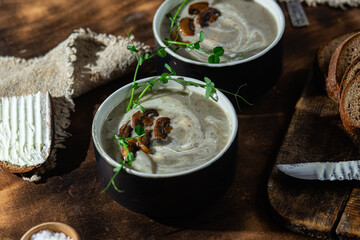Soup puree with mushrooms on a dark background