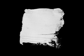 Abstract cream stroke of white paint. Raw thick white color dye imprint. Isolated on black...