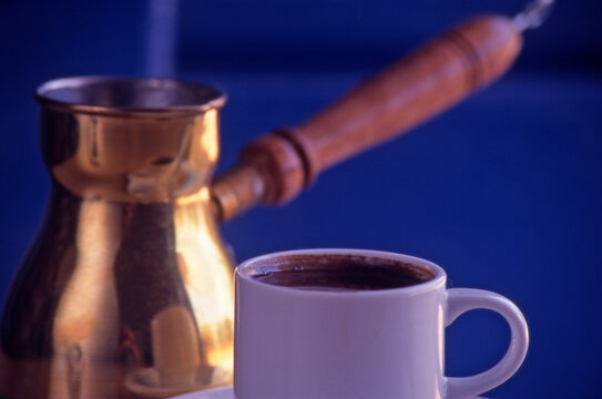 Iconic Cup of strong Greek Coffe and Copper Ibrk.