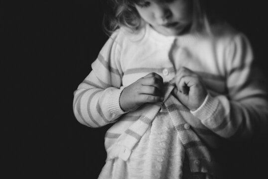 Toddler Learning To Button Sweater