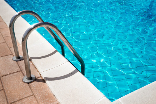Sunlight reflected in swimming pool, Puglia, Italy