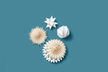 Paper New Year decorations on blue background.