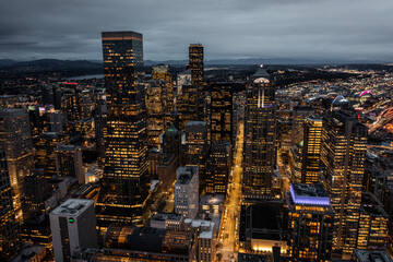 Seattle, Washington, USA - Jan.2023, night aerial view of illuminated Seattle Downtown with skyscrapers, traffic on streets - aerial night view