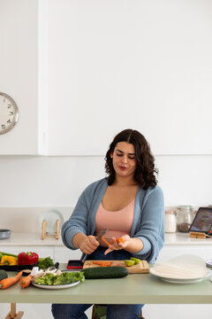 Young woman preparing lunch at home