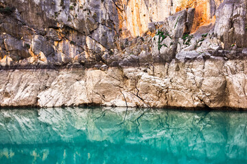 Rock, rock formation in the reflection of water. Nature of the Green Canyon in Turkey. Selective focus.