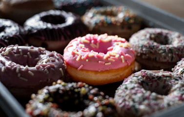 Assorted sweet donuts in box