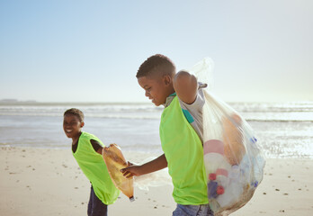 Children, beach and pollution with friends cleaning plastic or litter from the sand by the sea or ocean. Nature, recycle and environment with volunteer kids picking up trash, waste or garbage