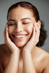 Face, skincare and makeup with a model black woman in studio on a gray background to promote...