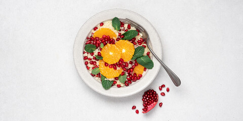 Couscous salad with oranges, pomegranate seeds and mint. Seasonal fruit salad. Middle eastern food