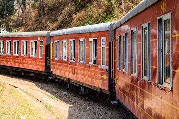 Toy Train moving on mountain slopes, beautiful view, one side mountain, one side valley moving on...