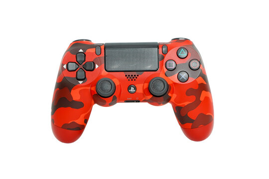 Bangkok, Thailand - January 8, 2023: Close up Sony dualshock 4 joy Camouflage Red ps4, Playstation 4 gaming console. video games console.