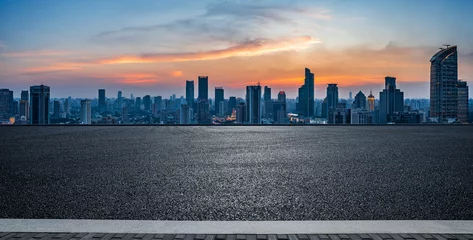 Foto op Canvas Asphalt road and city skyline with modern buildings at sunset in Shanghai, China. © ABCDstock