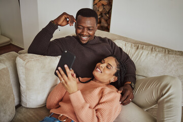 Black couple, phone and lounge couch while using home wifi for streaming internet or communication....