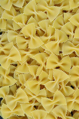 Pile of Farfalle Pasta Also Known As Bow-tie Pasta for banner or background