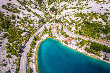 Scenic fishermen village Tribanj under Velebit mountain aerial view