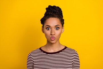 Portrait of pretty young lady pouted lips kiss look camera nice hairdo isolated on yellow color background