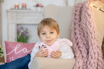 Fototapeta premium Valentine portrait of a little cute child with hearts, rose