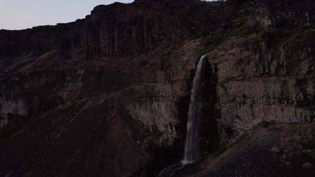 Aerial view of scenic Frenchmen coulee Waterfall at sunset, top destination for hiker and climbers scenic drone approaching canyon 