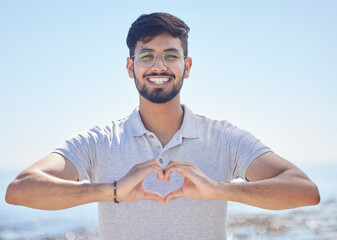 Beach portrait and a man heart hand for summer holiday freedom, happiness and wellness. Happy...