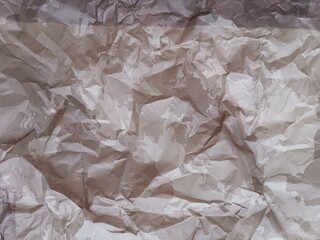 crumpled crumpled light colored rough paper