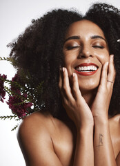 Peace, skincare and makeup girl with flowers satisfied with beauty and glowing texture routine. Aesthetic, health and wellness of confident black woman with beautiful smile in white studio.