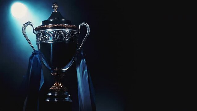 Award Trophy Best Product Sport Team Champion. Gold trophy Cup and shine on luxury background. Prizes for Champions. Concept of success, achievement, victory, a prize. symbol of sports games, fitness.